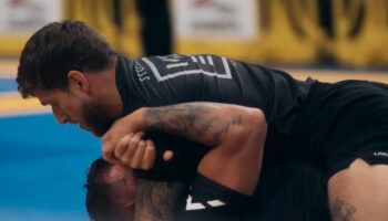 Practicing Brazilian Jiu Jitsu in a training session or competition.